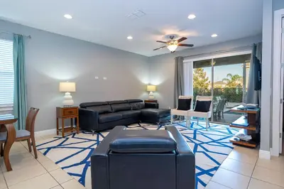 a living room with a couch and a table at Classic 8bd house - Encore Reunion Close to Disney in Orlando