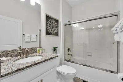a bathroom with a toilet and a sink and a shower at SHD4724 in Kissimmee