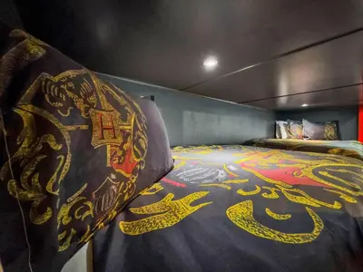 a bedroom with a bed with a dragon blanket at SHD4724 in Kissimmee