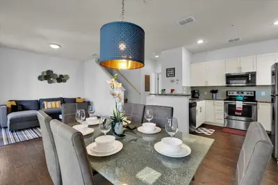 a dining room and kitchen with a table and chairs at GDL3206 in Kissimmee