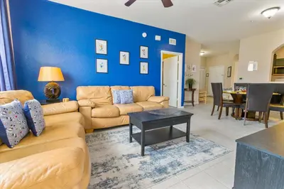 a living room with a couch and a table at ALM2784-404 in Orlando