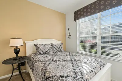a bedroom with a bed and a window at MSW2563 in Orlando