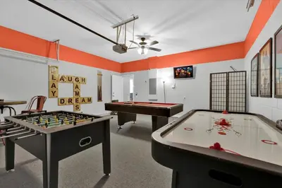 a room with two tables and a pool table at TT7752 Windsor Hills Resort 6br in Orlando