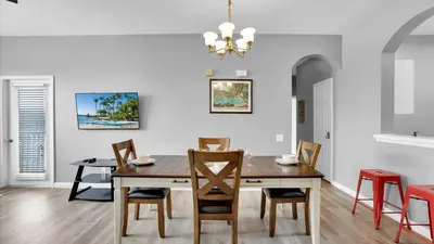 a dining room with a table and chairs at BF2301-301 Windsor Palms Resort 3 Bedroom in Kissimmee