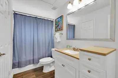 a bathroom with a sink and a toilet and a mirror at SP8131 Windsor Palms Resort 6 Bedroom in Kissimmee