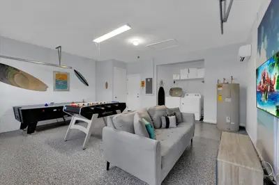 a living room with a couch and a pool table at SP8131 Windsor Palms Resort 6 Bedroom in Kissimmee
