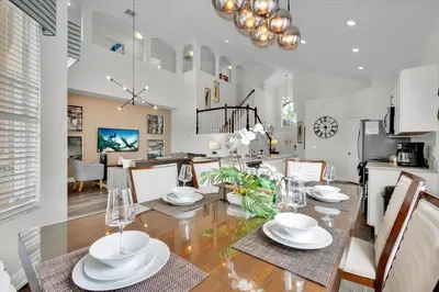 a dining room and kitchen with a table and chairs at SP8131 Windsor Palms Resort 6 Bedroom in Kissimmee