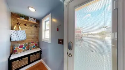 a small hallway with a door and a window at The Famous Houseboat in Sanford in Sanford