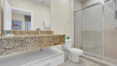 a bathroom with a sink and a toilet and a shower at RCF7646 in Orlando