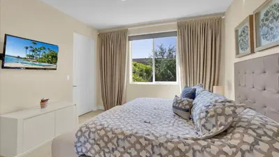 a bedroom with a bed and a large window at RCF7646 in Orlando