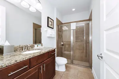 a bathroom with a toilet sink and a shower at Charming Home With Private Pool, Theme Rooms And Foosball Table Near Disney With Waterpark & Resort Access At Encore - 370La in Kissimmee