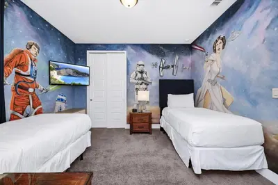 a bedroom with two beds and a mural at Charming Home With Private Pool, Theme Rooms And Foosball Table Near Disney With Waterpark & Resort Access At Encore - 370La in Kissimmee