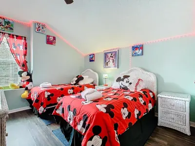 a bedroom with two beds with stuffed animals on them at Group retreat w pool, spa & BBQ in Orlando