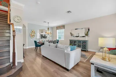 a living room with a white couch and a table at Getaway Cove Villa in Orlando