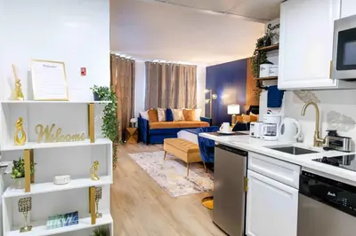 a kitchen and a living room with a couch at Luxury Lakeview Getaway 1 mile Universal Studios in Orlando