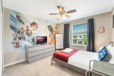 a bedroom with a superhero mural on the wall at Cozy home in the best location of orlando in Kissimmee