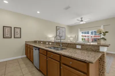 a kitchen with a sink and a window at Upstay Family Home w Resort Access & Private Pool in Kissimmee