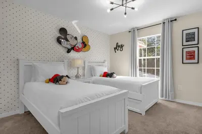 a bedroom with two white beds with stuffed animals on them at Upstay Family Home w Resort Access & Private Pool in Kissimmee