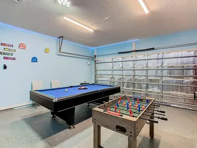 a billiard room with a pool table in a room at 4BR home w pool, spa & BBQ grill in Orlando