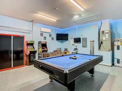 a billiard room with a pool table in a room at 4BR home w pool, spa & BBQ grill in Orlando