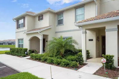 a house with a stop sign in front of it at Wonderful 4Bd with Pool at Storey Lake Resort 4819 in Kissimmee