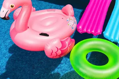 a toy pink flamingo toy next to a green item at NEW King Bed Disney Contemporary Townhouse in Kissimmee