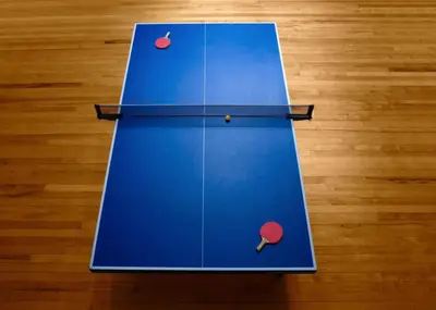 a blue table with two ping pong balls on it at NEW King Bed Disney Contemporary Townhouse in Kissimmee
