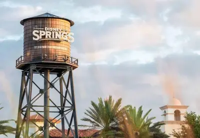 a water tower with the words dancing springs on it at King Bed Theme Park Hotel Free Shuttle Included in Orlando