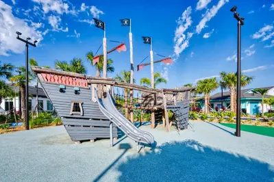 a playground at a resort with a slide at Stylish 4BR home Near Disney with Themed Rooms in Kissimmee