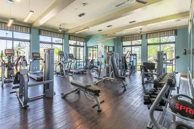 a gym with several treadmills and cardio machines at Modern Apt in Lake Nona, 10min to ORL Airport in Orlando