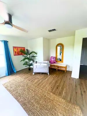 a living room with a couch and a table at Lilo & Stitch Themed Villa 10 Min to Disney! Heated Pool & Game Room in Orlando