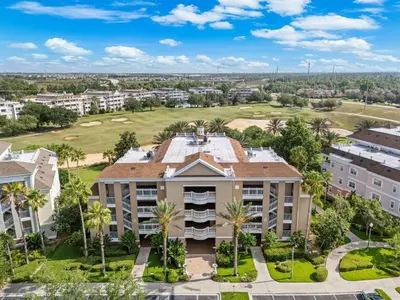 an aerial view of a building with palm trees at Villas North Charm in Orlando