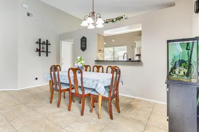 a dining room with a table and chairs at Swim, Golf and Relax Lovely Home in Lake Mary in Lake Mary