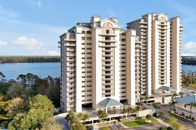 an aerial view of two large white apartment buildings at Disney Dream Condo & Lake View Awaits! in Orlando
