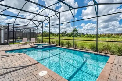 a swimming pool in a glass house with a view at 6Q/6B | Piscina Privativa | Game Room Temático in Kissimmee
