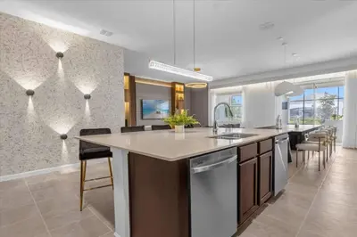 a kitchen with a large island in the middle at Beautiful and cozy at Veranda Palms in Kissimmee