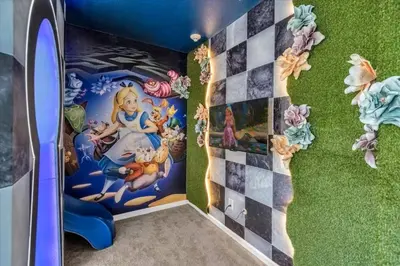 a room with a disney mural on the wall at Beautiful and cozy at Veranda Palms in Kissimmee