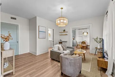 a living room with a couch and a table at SUPER BOHO - LAKE TOHO FISHiNG WATER FRONTs in Kissimmee