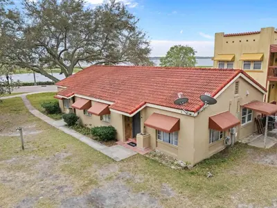 an overhead view of a house with a red roof at SUPER BOHO - At Lake Toho Fishing VINTaGE VIBEs in Kissimmee