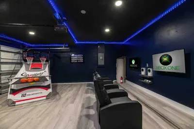 a gym with a basketball hoop and a bowling alley at SUPER GLAM - GAME ROOM and POOL in Orlando