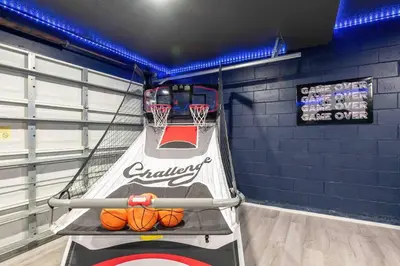 a gym with a basketball hoop in a room at SUPER GLAM - GAME ROOM and POOL in Orlando
