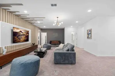a living room with a couch and chairs and a table at SUPER FANCY- 15BDR 17BAs HUGE 7 000SQFT HOME in Kissimmee