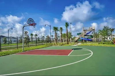a basketball court with a basketball hoop at Super Chill - 5 Bedrooms WPOOls in Kissimmee