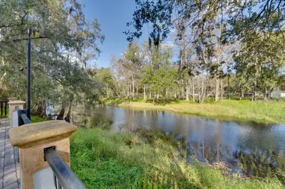 a view of a river with a wooden railing at 7 Mi to USTA Waterfront Tennis House with Yard! in Kissimmee