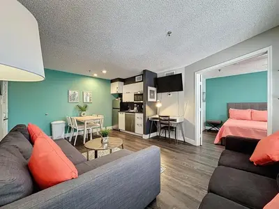 a living room with a couch and a bedroom at Two bed condo in Parkway Palms Resort condo in Orlando