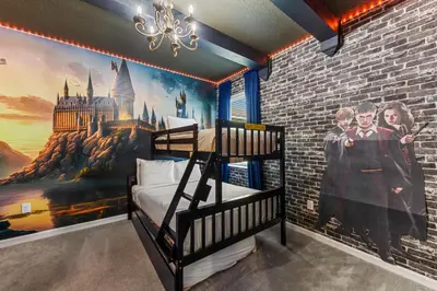 a bedroom with a mural of a castle and a bunk bed at 295 Marcello Blvd in Kissimmee