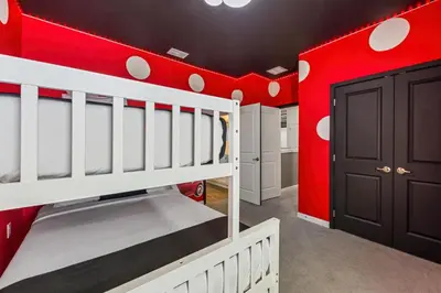 a red and white room with a bunk bed at 295 Marcello Blvd in Kissimmee