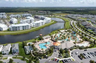 an aerial view of a resort with a river at Apartamento Moderno 2Q | Quarto Temático do Mickey in Kissimmee