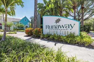 a sign for the runaways sign in front of a house at Two Bedroom Condo near Disney condo in Kissimmee