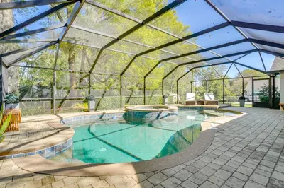 a swimming pool in a glass greenhouse with a swimming pool at Near Parks and Lakes Sorrento Home with Pool and Yard! in Sorrento